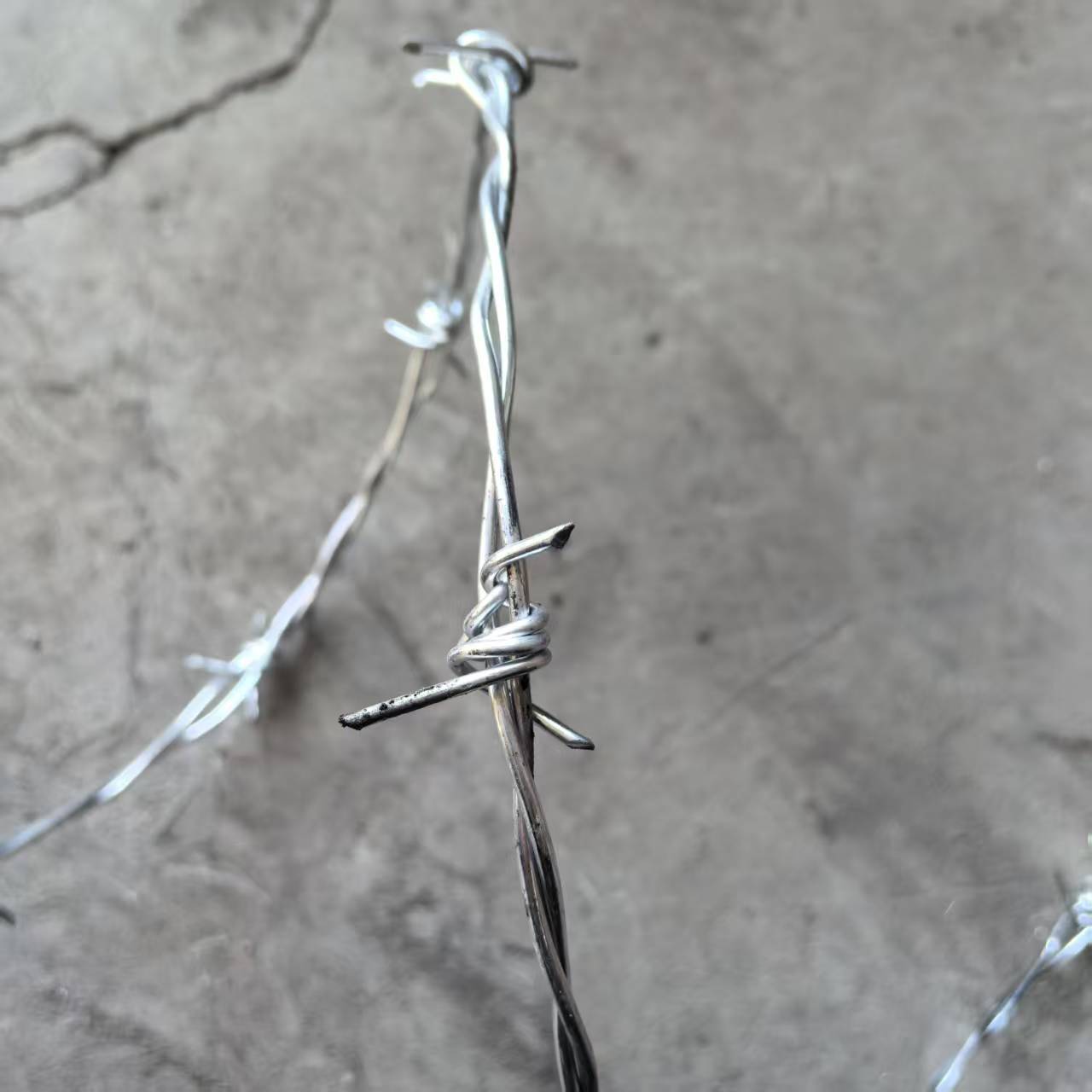 Galvanized barbed wire roll in factory