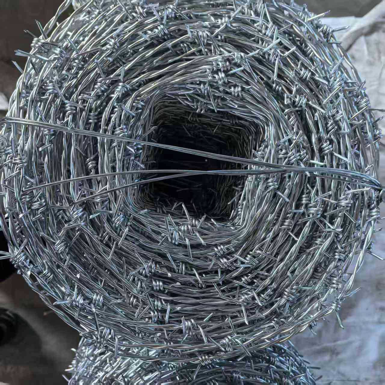 Barbed wire installed on farm fence