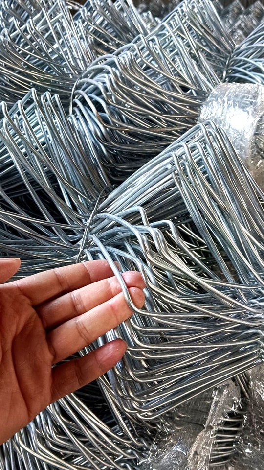 Galvanized chain link fence in production